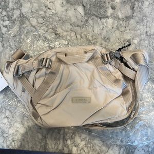 Athleta Excursion Waistbag in sand color.